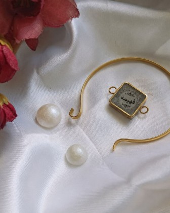 Handmade pieces of resin jewelry made by the English teacher